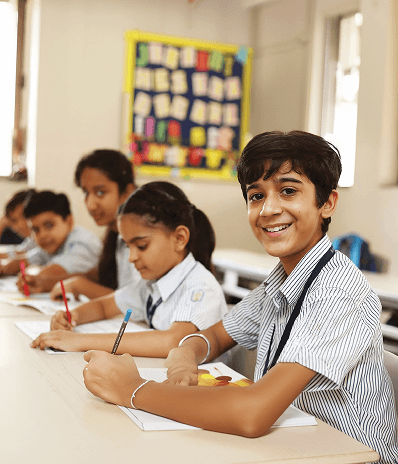 Students learning and participating in classroom activities at Navkis Educational Centre